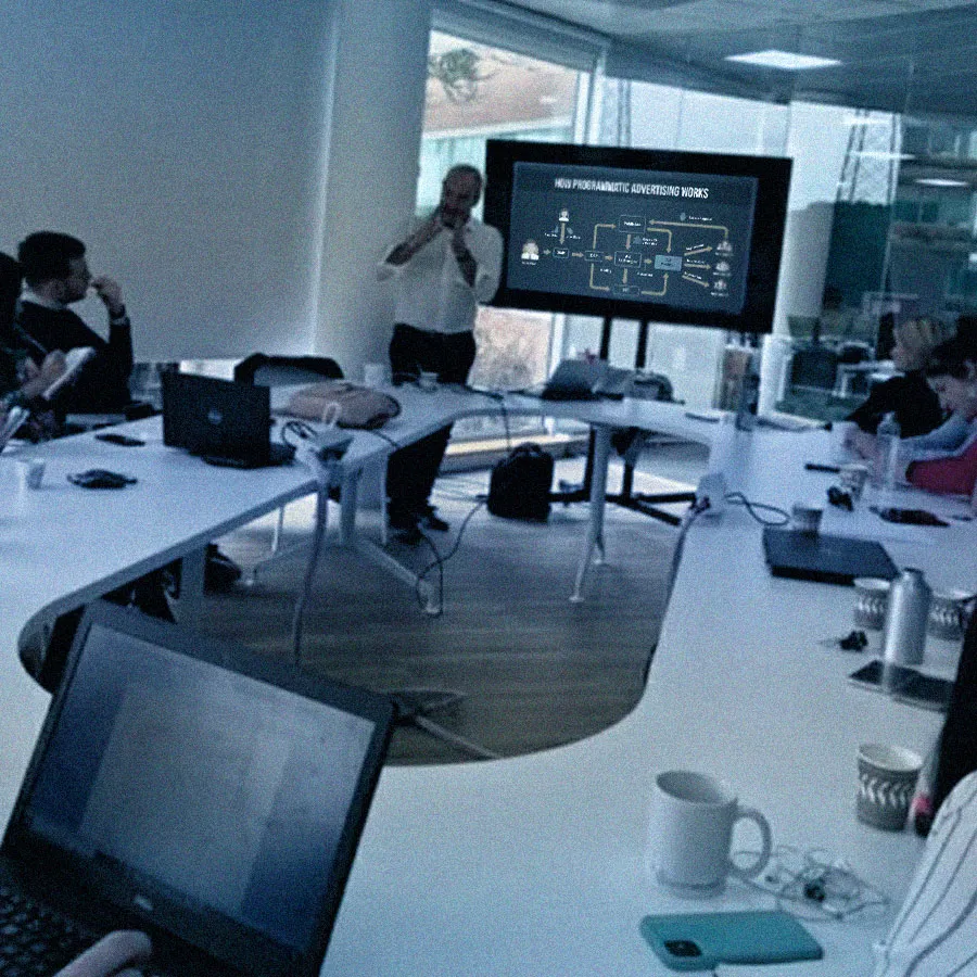 Workshop session with a client team around a shared screen